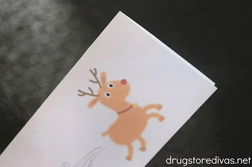 A paper with a reindeer graphic on it.