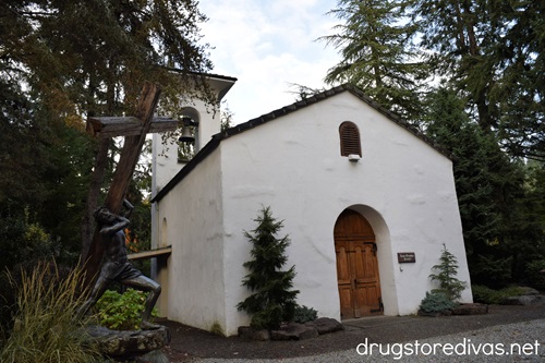 A white chapel with a large Jesus and cross statue to the left at Boehm's Candies in Issaquah, Washington.
