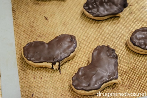 Heart cookies with chocolate on top.