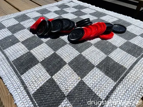 An oversized checkers game outside.