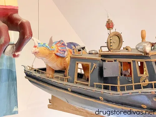 A blow up triceratops on a boat in Ponysaurus Brewing in Wilmington, NC.