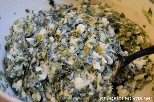 Spanakoita filling in a white bowl.
