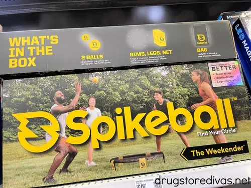 A Spikeball game in a box on a shelf in a store.