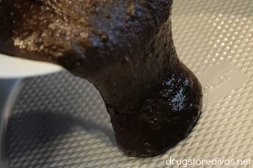 Brownie batter being poured into a pan.