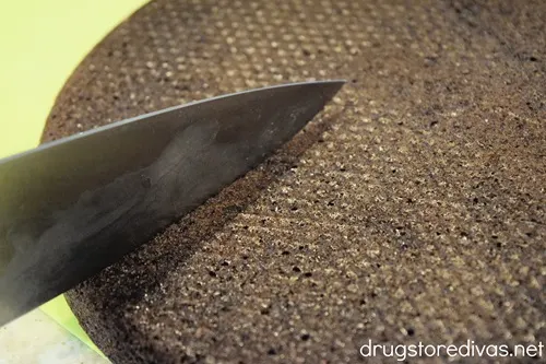 A knife cutting brownies.