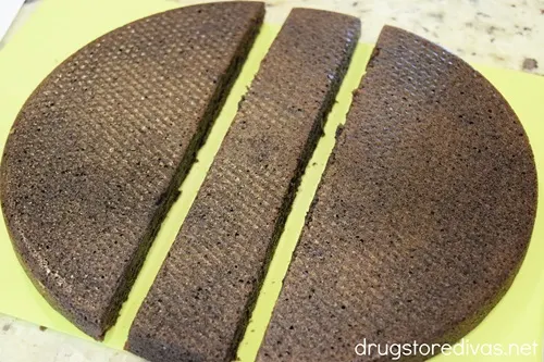 A strip cut from the middle of a large round brownie.