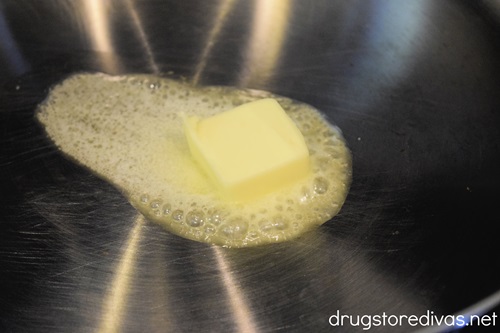 Butter melting in a large pan.