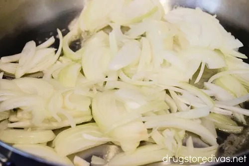 Sliced onions in a pan.
