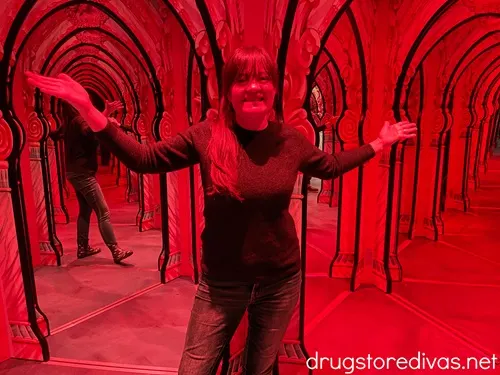 A woman in a mirror maze.