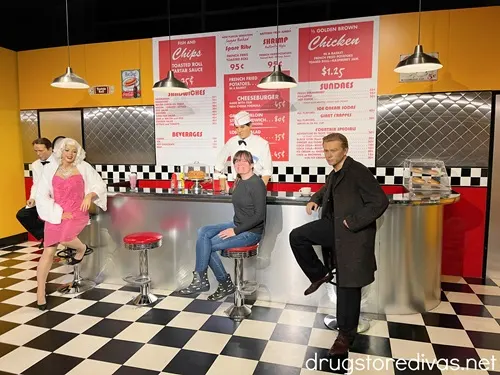A woman at a soda shop with three wax figures at the Hollywood Wax Museum in Myrtle Beach, SC.