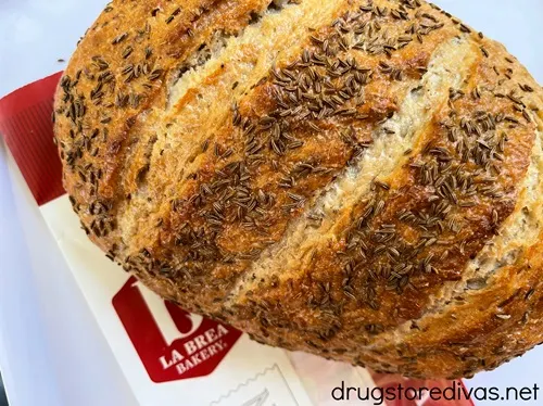 A load of rye bread on top of La Brea Bakery packaing.