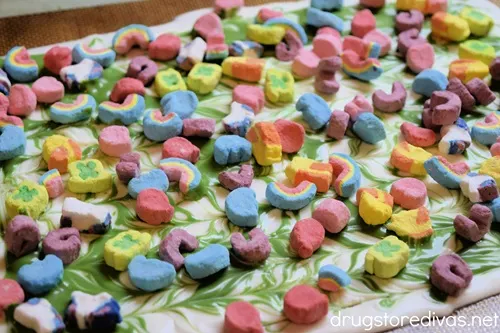 Lucky Charm marshmallows over the top of green and white swirled chocolate.