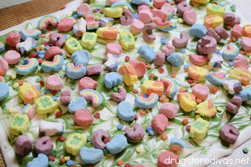 Lucky Charm marshmallows and sprinkles over the top of green and white swirled chocolate.
