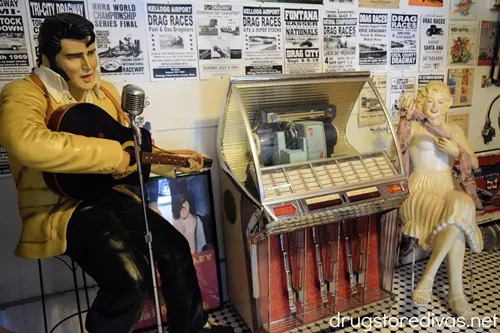 A life-sized Elvis and Marilyn Monroe with a jukebox between them in the Nostalgic Filling Station in Laurens, SC.