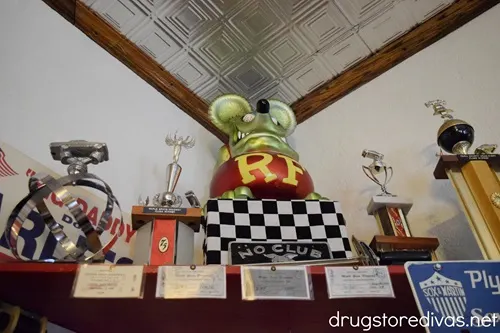 Trophies next to a rat fink figurine in the Nostalgic Filling Station in Laurens, SC.