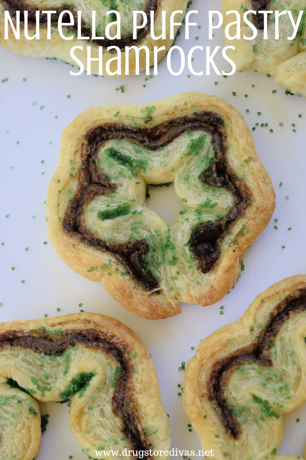Five puff pastry cookies that look like shamrocks with the words 
