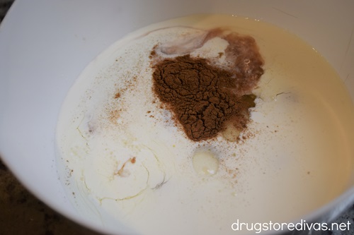 White liquid and cinnamon in a white bowl.