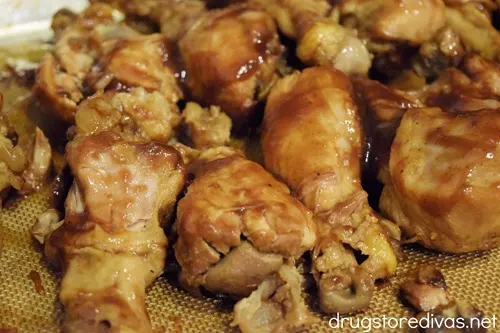 Chicken drumsticks on a tray.