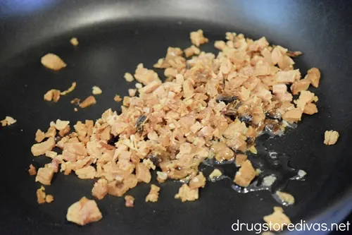 Shredded ham cooking in a pan.