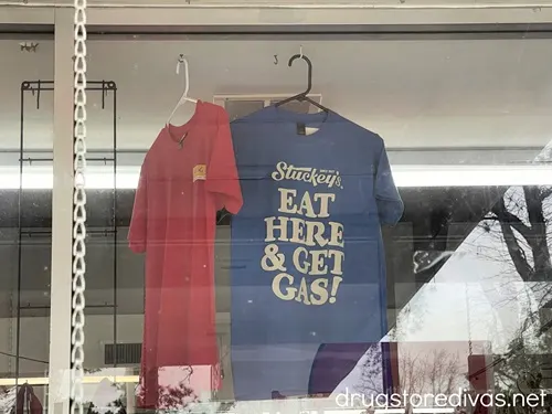 Stuckey's t-shirts hanging in the window of a Stuckey's store.
