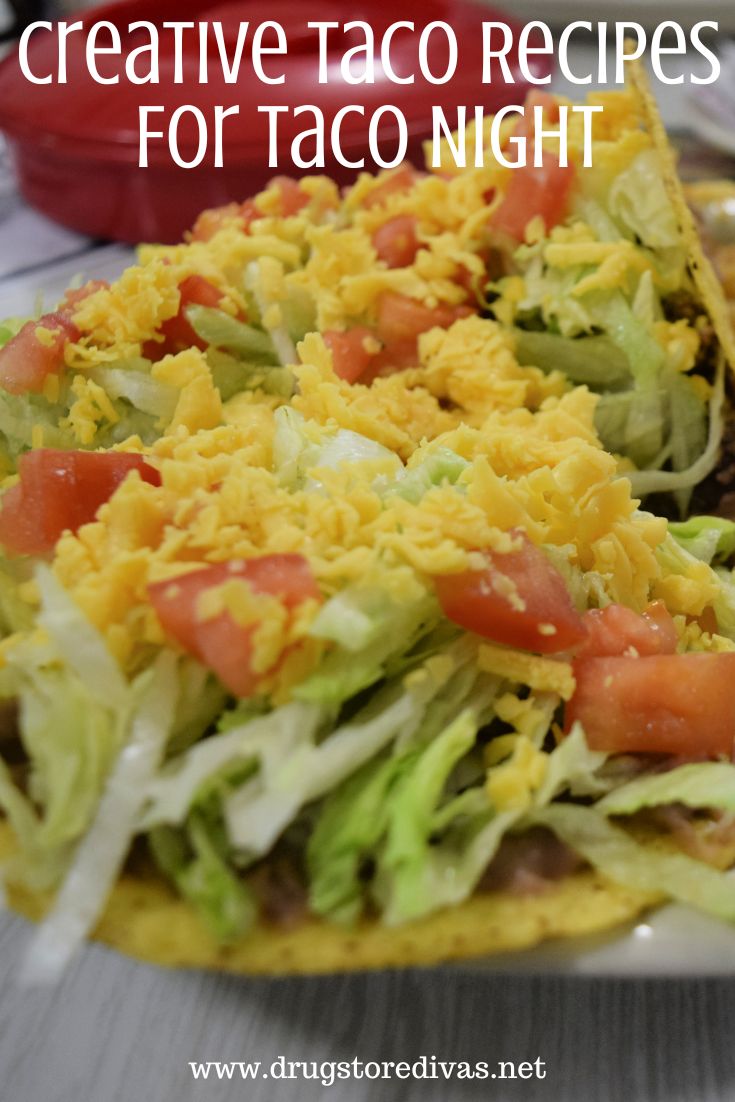 Tacos with lettuce, tomatoes, and cheese with the words 