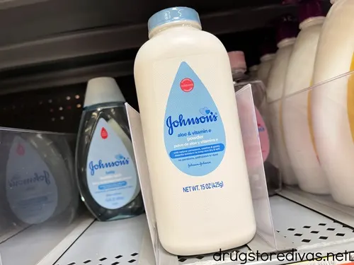 Baby powder and baby shampoo on a shelf in the store.