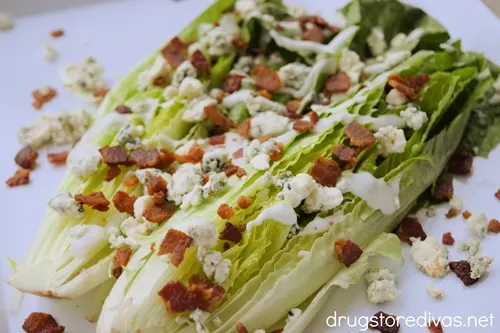Bacon And Bleu Cheese Salad halves on a white tray.