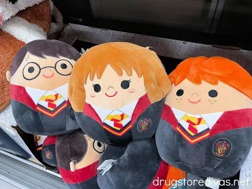 Squishmallow dolls designed to look like Happy Potter, Hermione Granger, and Ron Weasley.