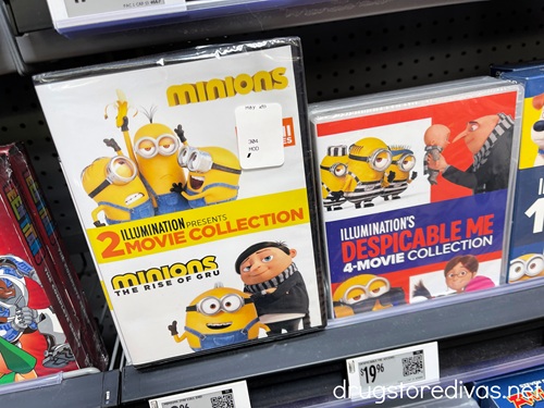 Two Minions DVD boxes on a shelf in a store.