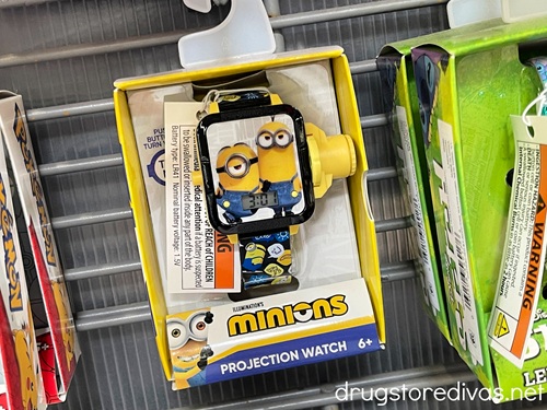 A Minions watch in a box on a peg in a store.