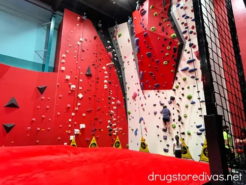 A man on a bouldering wall at OC Aerial, a ninja warrior gym in Durham, North Carolina.