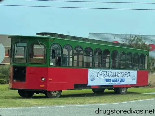 A trolly with an advertisement for the Wilmington Greek Festival on the side.