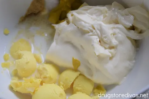 Mayonnaise, egg yolk, and milk in a white bowl.