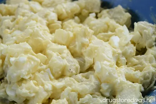 A blue bowl filled with Classic Potato Salad.