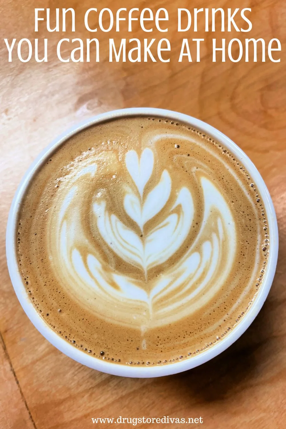 A latte with a fancy design on it and the words 