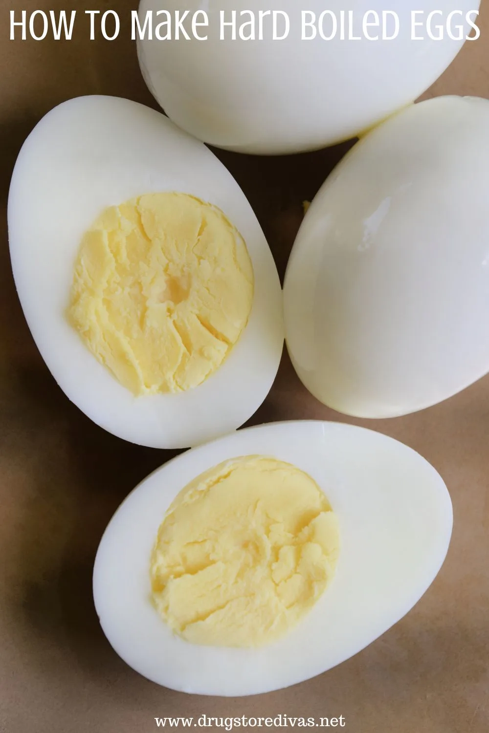 Three hard boiled eggs, one of which is cut in half, on a brown plate and the words 