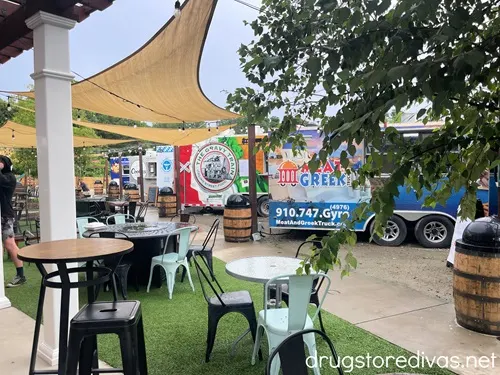 Food trucks and tables set up at Red's Corner, a bar in Southern Pines, NC.