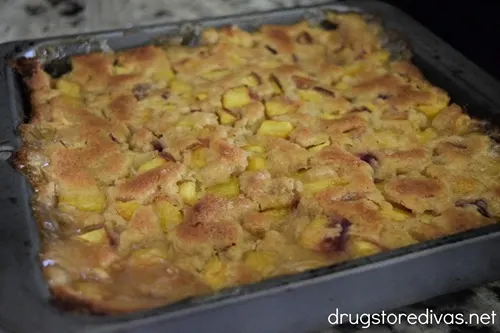 Baked Tennessee Peach Pudding in a square pan.