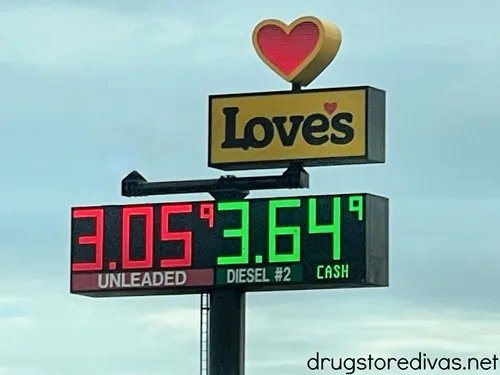 A sign advertising gas prices at a Love's Travel Stop gas station.
