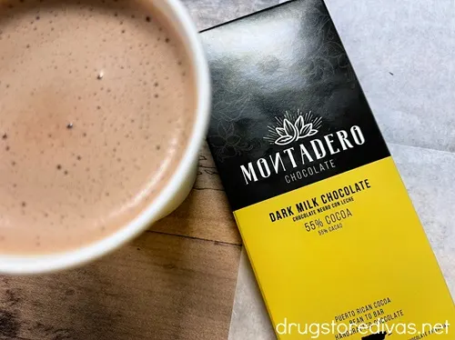 A bar of chocolate next to a paper cup with hot chocolate in Montadero Chocolate in Caguas, Puerto Rico.