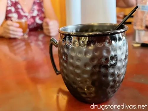 A Moscow mule mug on a table.