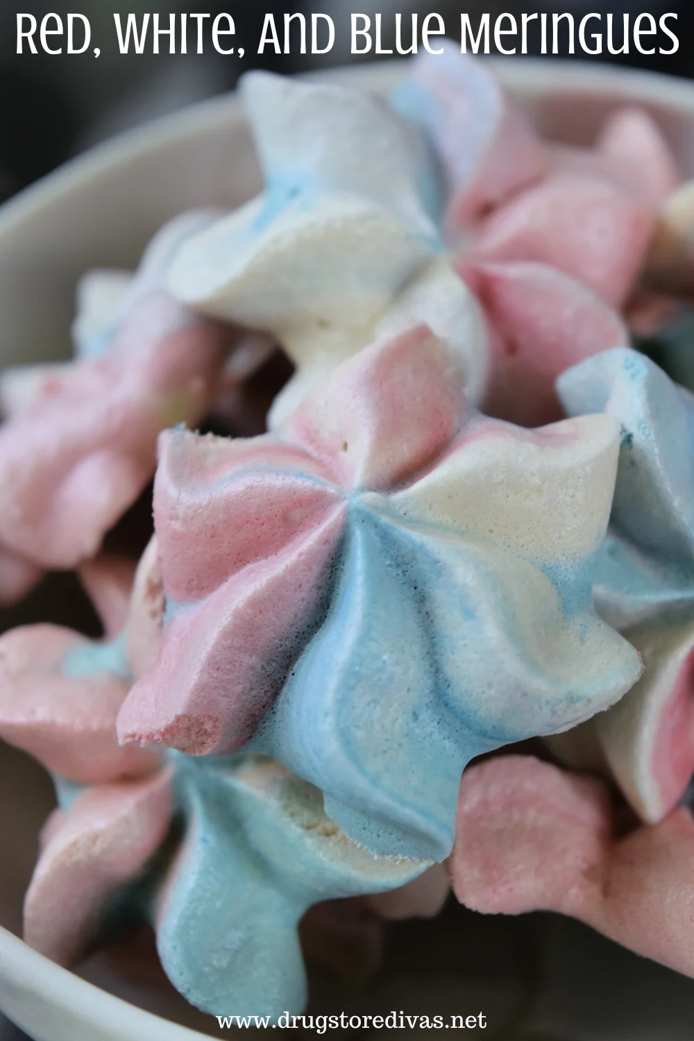 Star-shaped cookies that are red, white, and blue with the words 