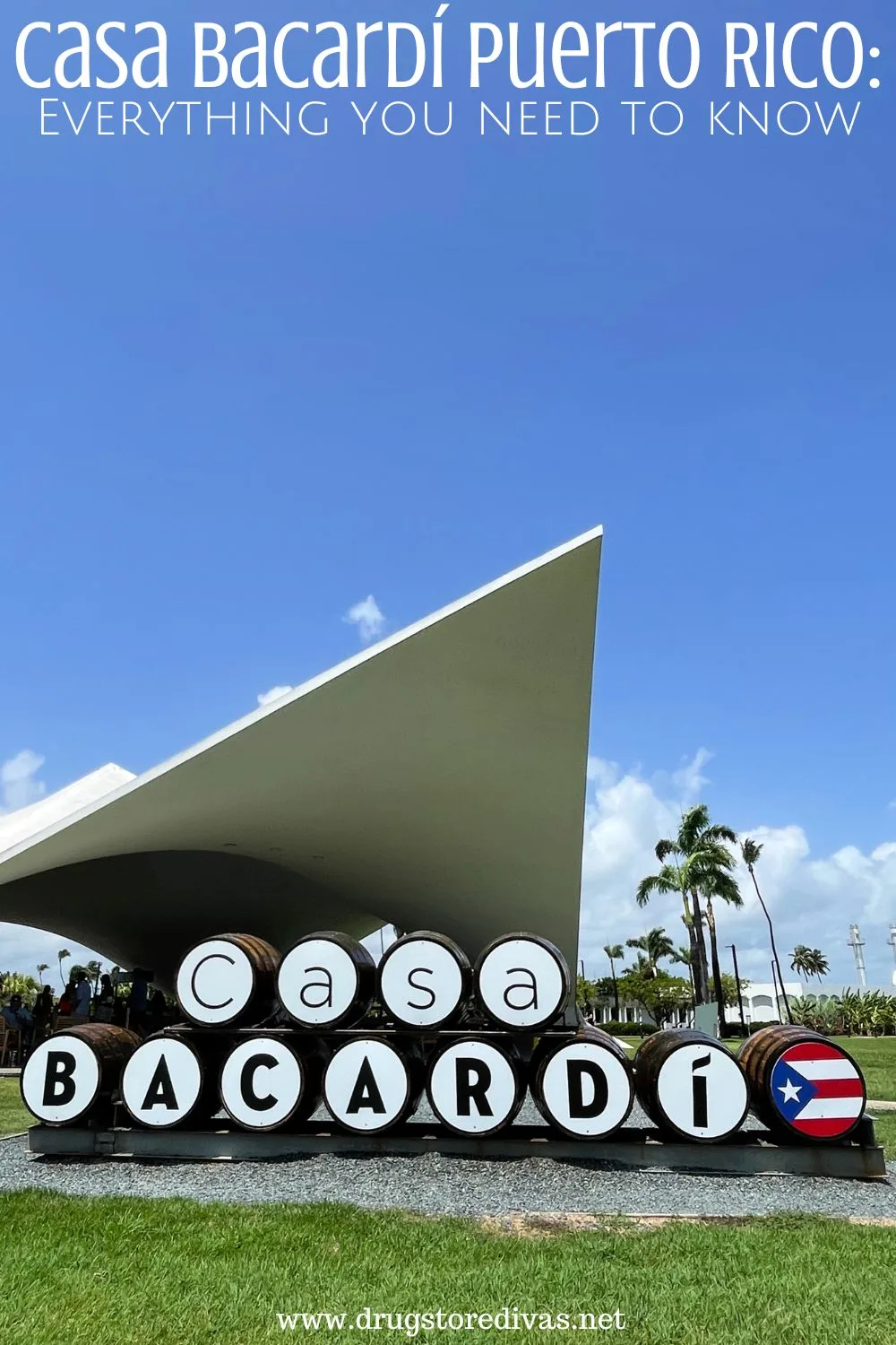 Barrels on their side spelling out CASA BACARDI in front of a pavilion with the words 