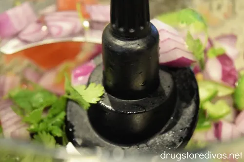 Red onion and cilantro in a food processor.