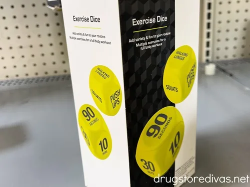 Exercise dice in a package on a shelf.