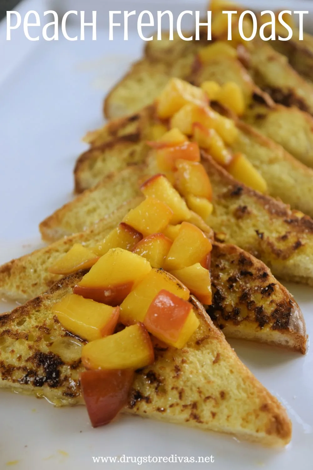Eight triangles of French toast with cubed peaches on them on a white tray with the words 
