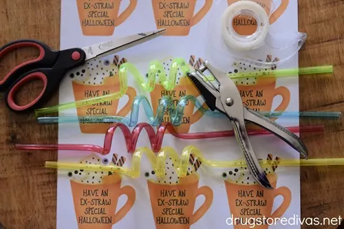 A printable with coffee cups, scissors, four crazy straws, tape, and a single hole punch.