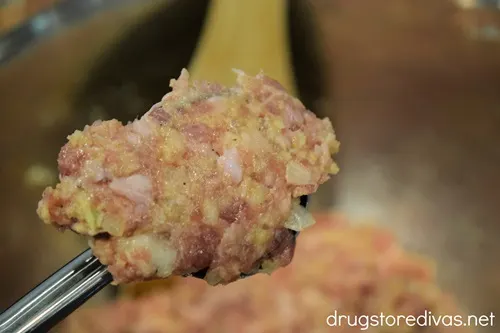 Meatloaf mixture in a cookie scoop.