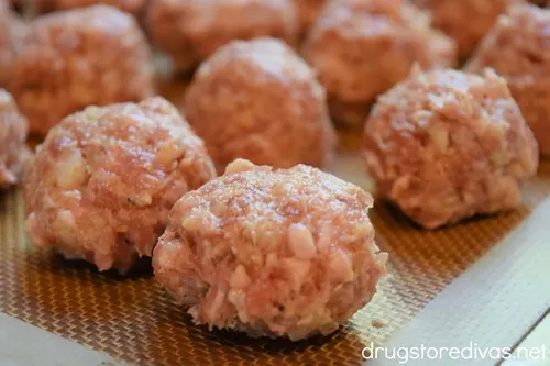 Meatballs on a cookie sheet.