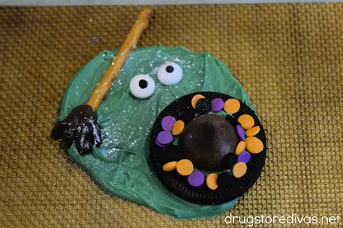 A melted witch candy on a silicone baking mat.